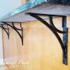 imageEkena Millwork BKTM01X10X12SVE 1 2 W x 10 D x 12 H Versailles Wrought Iron Bracket Single Center BraceAntiqued Copper